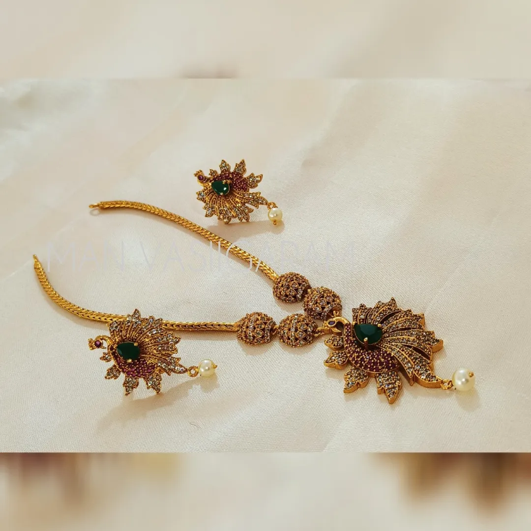 Peacock Attigai with earrings at M.A.N VASIIGARAM